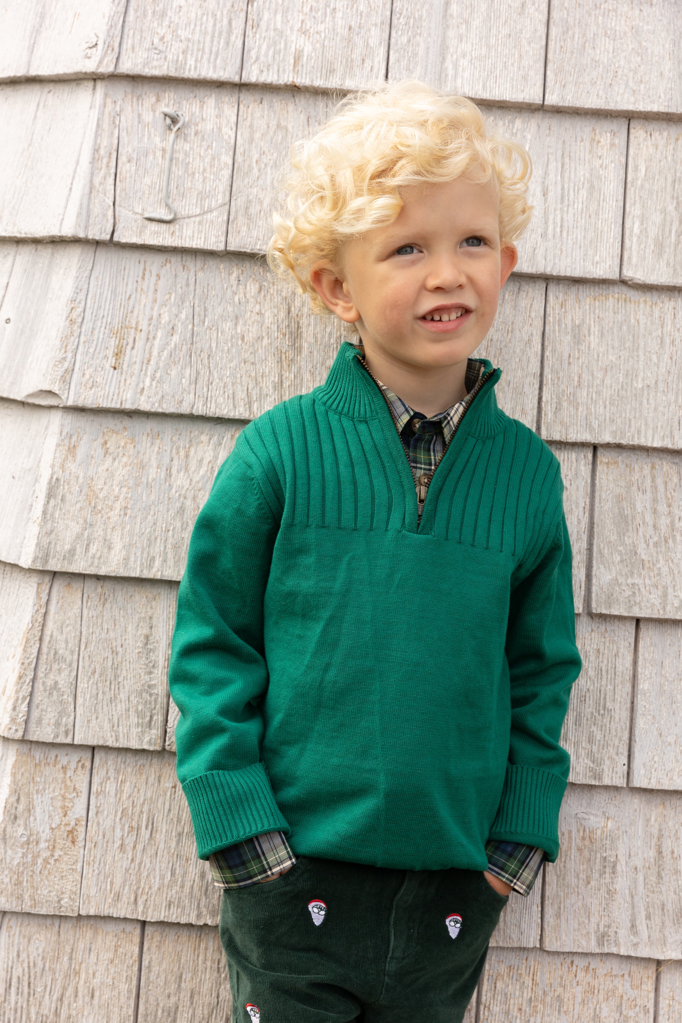 Little boy wearing boys' and toddler cotton quarter-zip sweater in green, Aspen style, perfect for layering in cooler weather
