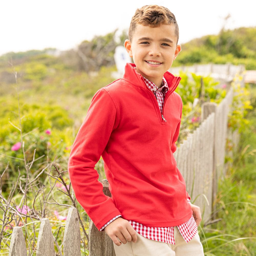 Young boy wearing Boys' and toddler red Astor 1/4 zip pullover in red, perfect for layering and cooler weather