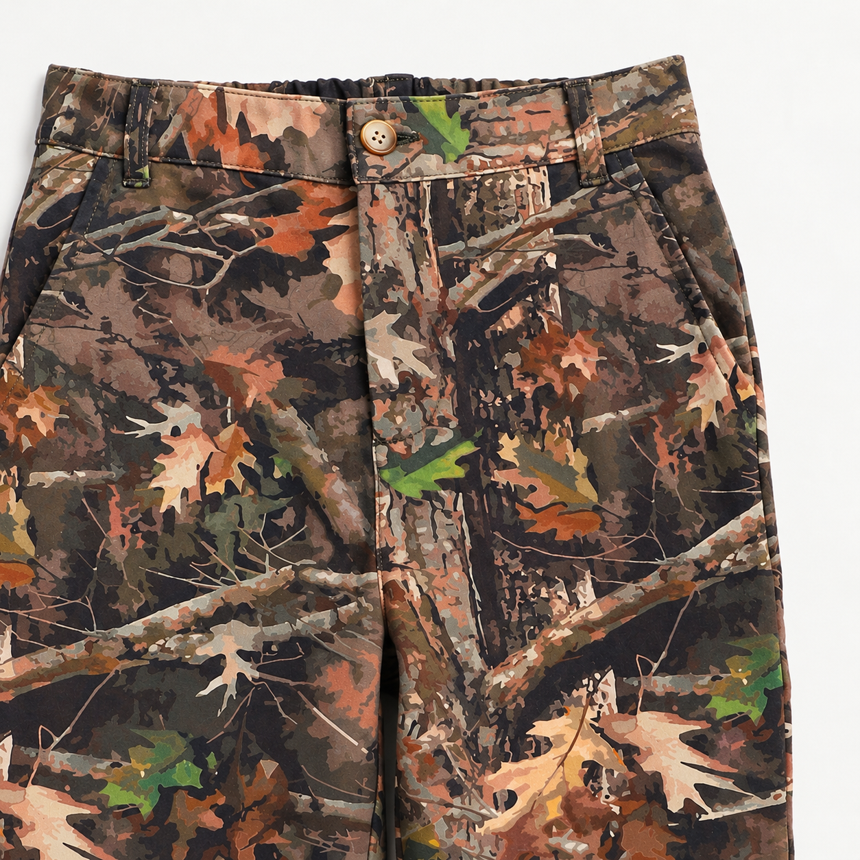 Close-up of Camo-Flex boys’ camo pants showing the button closure, belt loops, and waistband
